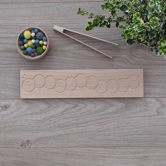 Montessori inspired counting board with caterpillar engraving with felt balls 