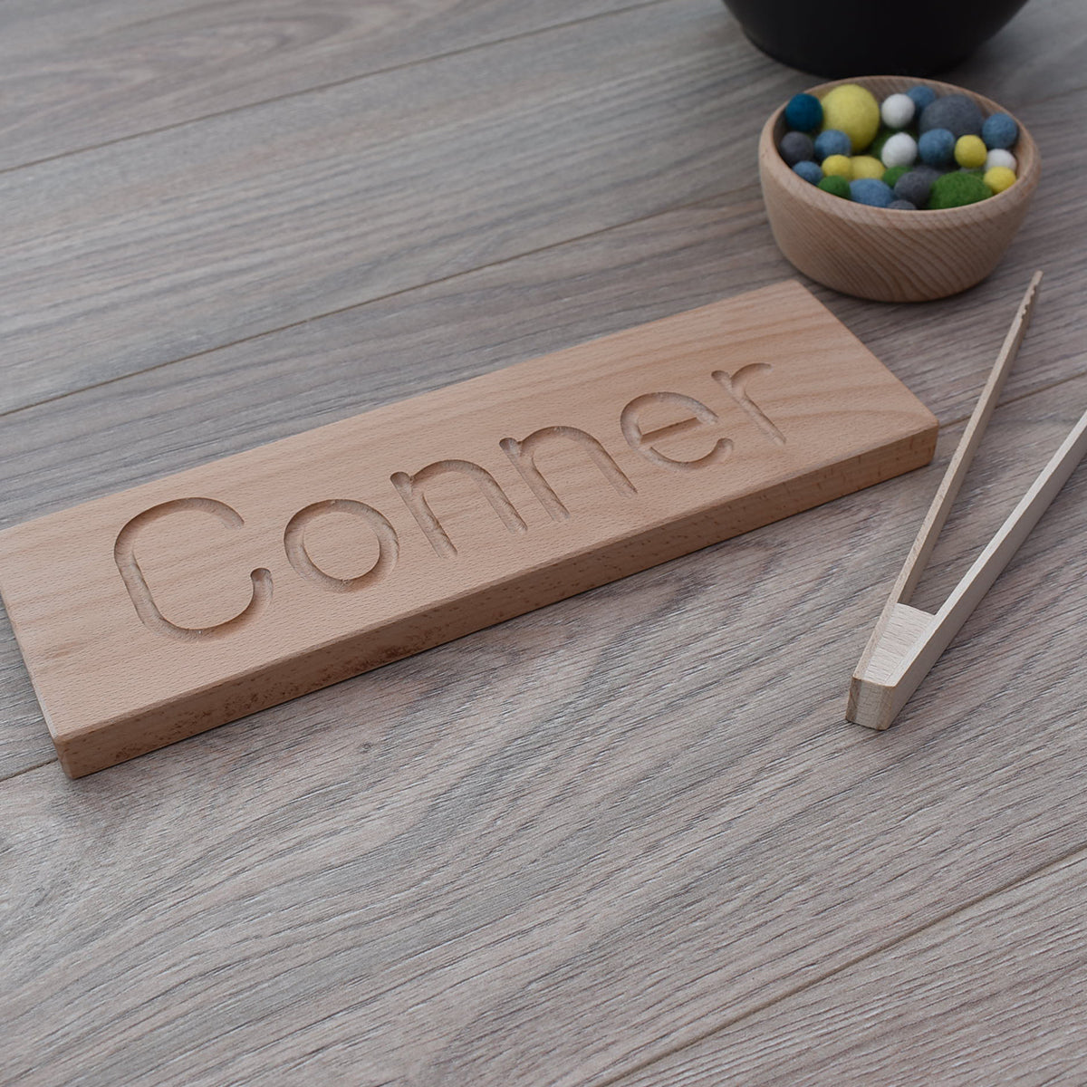 Connor DrawMe personalised wooden name board used for learning to write and fine motor skill sensory play