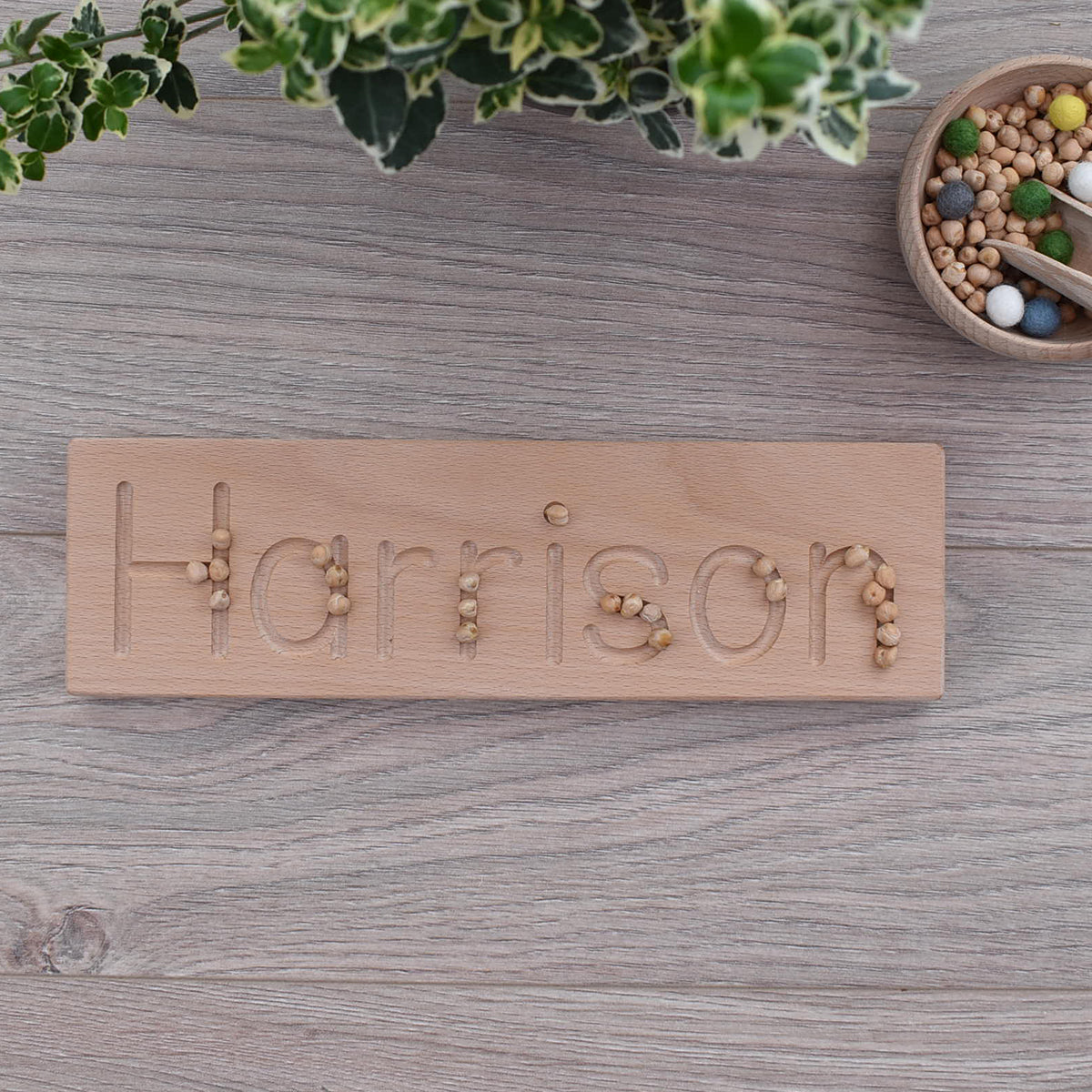 Harrison DrawMe personalised wooden name board used for learning to write and fine motor skill sensory play