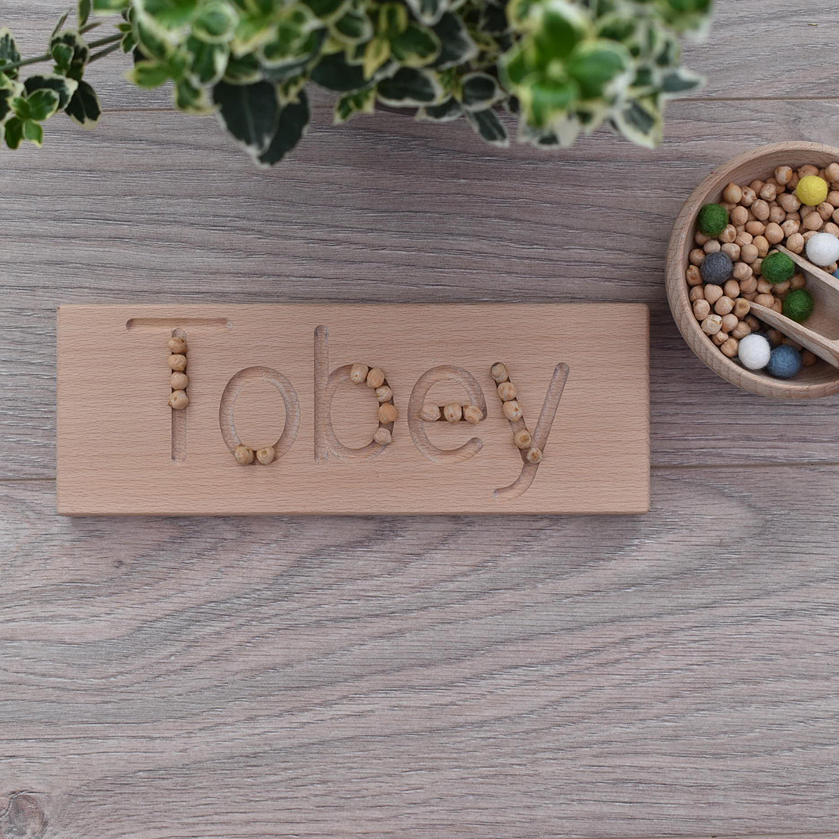Tobey DrawMe personalised wooden name board used for learning to write and fine motor skill sensory play
